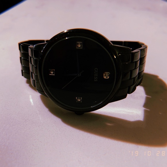 Black sleek Guess watch